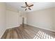 Spacious bedroom with wood-look flooring and a ceiling fan for added comfort at 274 Pear Meadow St, Henderson, NV 89012