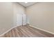 Bedroom featuring wood-look flooring and a closet with folding doors at 274 Pear Meadow St, Henderson, NV 89012