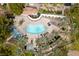 Stunning aerial view of a community pool, surrounded by palm trees and comfortable lounge areas at 274 Pear Meadow St, Henderson, NV 89012