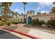 Gated entrance with unique architecture, beautiful landscaping, and a brick-paved driveway at 274 Pear Meadow St, Henderson, NV 89012