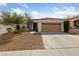 Charming single-story home featuring a well-maintained yard and a two-car garage at 274 Pear Meadow St, Henderson, NV 89012