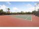 A fenced in tennis court surrounded by mature landscaping at 274 Pear Meadow St, Henderson, NV 89012