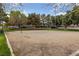 A sand volleyball court with mature landscaping at 274 Pear Meadow St, Henderson, NV 89012