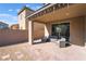 Covered patio with brick pavers offers a charming outdoor living space with comfortable seating area at 2878 Chalk Mountain Ct, Las Vegas, NV 89142