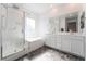 Bathroom featuring a shower and separate soaking tub with double sink vanity and modern finishes at 2878 Chalk Mountain Ct, Las Vegas, NV 89142