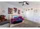 Bright bedroom featuring Spiderman-themed bedding, fan, and themed wall art at 2878 Chalk Mountain Ct, Las Vegas, NV 89142