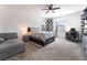 Bright bedroom featuring a ceiling fan, a work station, and a comfortable seating area at 2878 Chalk Mountain Ct, Las Vegas, NV 89142
