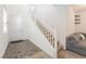 Bright entryway featuring a white staircase and tile flooring at 2878 Chalk Mountain Ct, Las Vegas, NV 89142