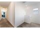 Upstairs hallway with neutral walls and carpet leading to various rooms in the home at 2878 Chalk Mountain Ct, Las Vegas, NV 89142