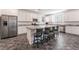Modern kitchen with stainless steel appliances, granite countertops, large island and bar stool seating at 2878 Chalk Mountain Ct, Las Vegas, NV 89142