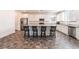 Modern kitchen with stainless steel appliances, granite countertops, large island and bar stool seating at 2878 Chalk Mountain Ct, Las Vegas, NV 89142