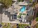 Aerial view showcasing the expansive property, private pool, solar panels, and lush landscaping at 3010 La Mesa Dr, Henderson, NV 89014