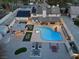 Sprawling backyard featuring a pool, spa, covered patio, and outdoor kitchen area at 3010 La Mesa Dr, Henderson, NV 89014