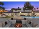 Inviting backyard with a pool, fire pit, and outdoor seating areas at 3010 La Mesa Dr, Henderson, NV 89014