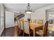 Classic dining room showcasing a wooden table, ornate chairs, and hardwood floors at 3010 La Mesa Dr, Henderson, NV 89014