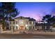 Elegant two-story home with a grand entrance and well-maintained landscaping at 3010 La Mesa Dr, Henderson, NV 89014