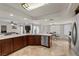 Spacious kitchen boasts granite countertops, stainless steel appliances, and an open layout connecting to living spaces at 3010 La Mesa Dr, Henderson, NV 89014