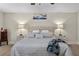 Serene main bedroom featuring a comfortable king-sized bed with stylish bedside tables and lamps at 3010 La Mesa Dr, Henderson, NV 89014