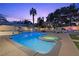 Sparkling pool and spa with a slide and manicured landscaping at 3010 La Mesa Dr, Henderson, NV 89014