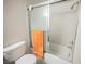Bright bathroom featuring a shower-tub combination and sliding glass door at 3135 S Mojave Rd # 241, Las Vegas, NV 89121