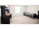 Bright bedroom offers comfortable living space with a desk and a large window at 3135 S Mojave Rd # 241, Las Vegas, NV 89121