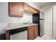 Modern kitchen featuring stainless steel appliances, wood cabinets, and stone countertops at 3135 S Mojave Rd # 241, Las Vegas, NV 89121