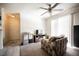 Spacious living room with carpet, ceiling fan, and sliding glass door to the outside at 3135 S Mojave Rd # 241, Las Vegas, NV 89121
