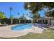 Community pool with lounge chairs and manicured landscaping at 3135 S Mojave Rd # 241, Las Vegas, NV 89121