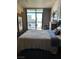 Bright bedroom with a view of the city, stainless steel fridge, and table at 353 E Bonneville Ave # 631, Las Vegas, NV 89101