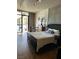 Well-lit bedroom with a view, hardwood floors, and modern decor at 353 E Bonneville Ave # 631, Las Vegas, NV 89101
