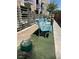 Exterior common area with benches and a water fountain on artificial turf, offering a welcoming space at 353 E Bonneville Ave # 631, Las Vegas, NV 89101
