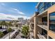 Exterior view showcasing the building's architecture with city skyline views, palm trees, and mountain views at 353 E Bonneville Ave # 631, Las Vegas, NV 89101