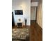 Hallway with a modern flat screen TV and decorative floral arrangement at 353 E Bonneville Ave # 631, Las Vegas, NV 89101
