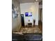 Inviting living room featuring a wall-mounted TV, modern decor, a comfortable gray sofa, and a stylish rug on hardwood floors at 353 E Bonneville Ave # 631, Las Vegas, NV 89101