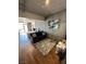 Open-concept living space with a view to the bedroom, modern decor, comfortable sofa and stylish rug on hardwood floors at 353 E Bonneville Ave # 631, Las Vegas, NV 89101