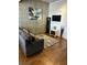 Inviting living room featuring modern decor, a comfortable gray sofa, and a stylish rug on hardwood floors at 353 E Bonneville Ave # 631, Las Vegas, NV 89101
