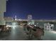 Rooftop outdoor dining area at night with amazing city views at 353 E Bonneville Ave # 631, Las Vegas, NV 89101