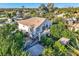 Aerial view of home with lush landscaping, pool, and unique spiral staircase at 3560 Five Pennies Ln, Las Vegas, NV 89120