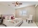 Bright bedroom features plantation shutters, plush bedding, and a stylish accent chair at 3560 Five Pennies Ln, Las Vegas, NV 89120