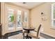 Bright breakfast nook has outdoor access to patio with well-lit views and neutral finishes at 3560 Five Pennies Ln, Las Vegas, NV 89120