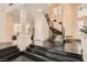 Elegant foyer with a grand staircase and high ceilings, showcasing the home's luxurious design and spacious layout at 3560 Five Pennies Ln, Las Vegas, NV 89120