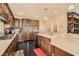 Spacious kitchen featuring dark wood cabinets and a breakfast bar, perfect for everyday meals and gatherings at 3560 Five Pennies Ln, Las Vegas, NV 89120