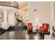 Spacious living room with a grand staircase, fireplace, and dark wood floors, perfect for entertaining and relaxation at 3560 Five Pennies Ln, Las Vegas, NV 89120