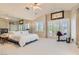 Spacious primary suite features vaulted ceilings, a fireplace and balcony access at 3560 Five Pennies Ln, Las Vegas, NV 89120