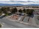A home nestled among mature trees with desert landscaping and mountain views, highlighting the serene setting at 3580 Unicorn Ave, Pahrump, NV 89048