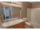 Bathroom with a double sink vanity, a shower-tub combo, and tile flooring at 3580 Unicorn Ave, Pahrump, NV 89048