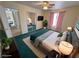 Comfortable bedroom featuring an accent rug, TV, ceiling fan and closet at 3580 Unicorn Ave, Pahrump, NV 89048