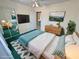 Cozy bedroom features a full-size bed, dresser and mirror closet doors at 3580 Unicorn Ave, Pahrump, NV 89048