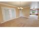 Bright dining room with elegant chandelier and french doors at 3580 Unicorn Ave, Pahrump, NV 89048