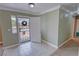 Bright entryway featuring tile flooring, a small window to the left, and an open white door at 3580 Unicorn Ave, Pahrump, NV 89048